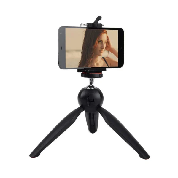 Universal mini tripod for camera and phone Universal mini tripod for camera and phone Mini tripod with adjustable height Mini tripod for phone and DSLR with stabilizer Close-up of mini tripod stand Mini tripod with ball head and adjustable legs Compact mini tripod for photography Mini tripod with phone holder Mini tripod in use with camera Universal Mini Tripod